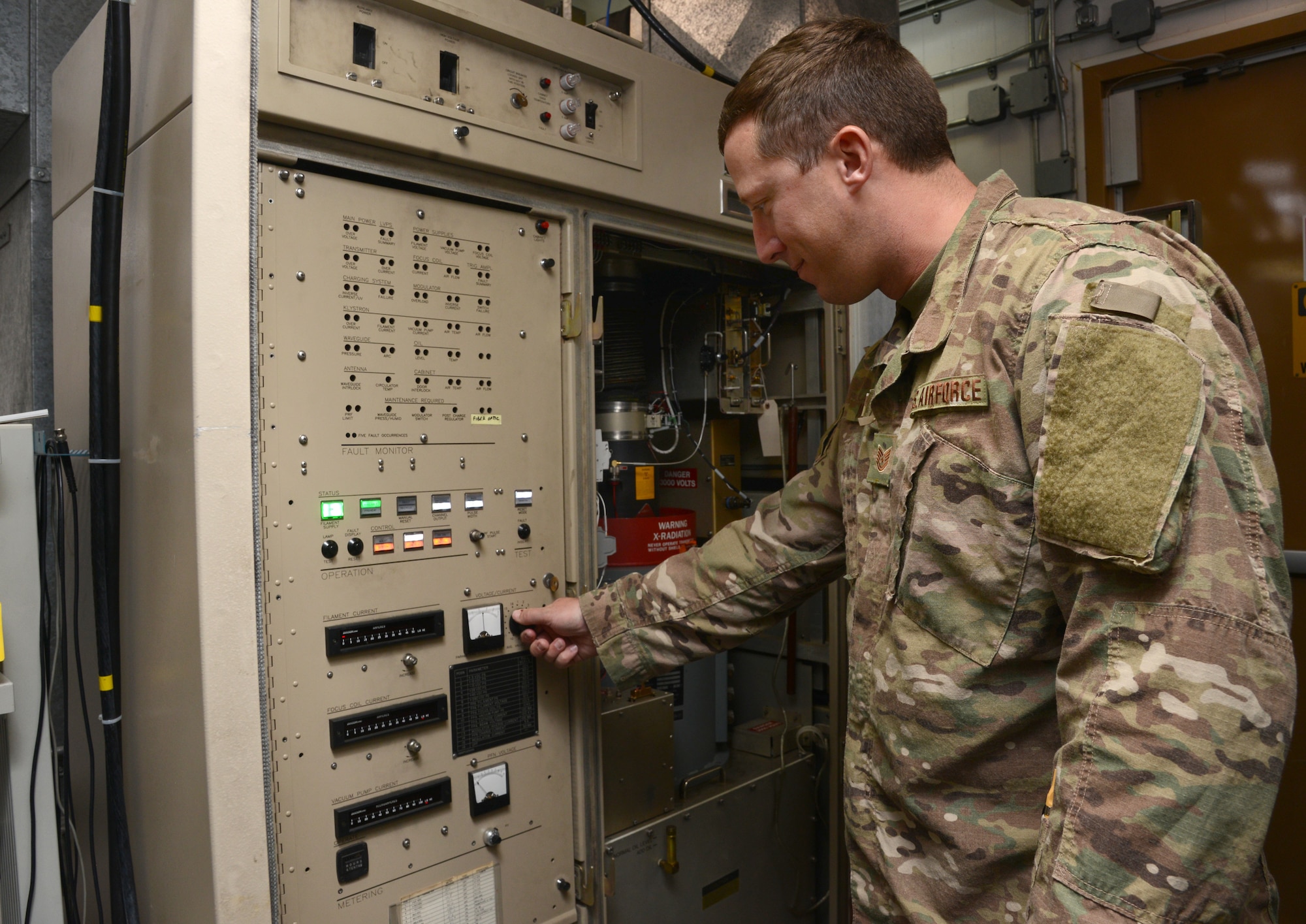 Tech. Sgt. Chris Marek, with the Radar Operations Center, works on an internal unit within the test radar at their center in Norman.