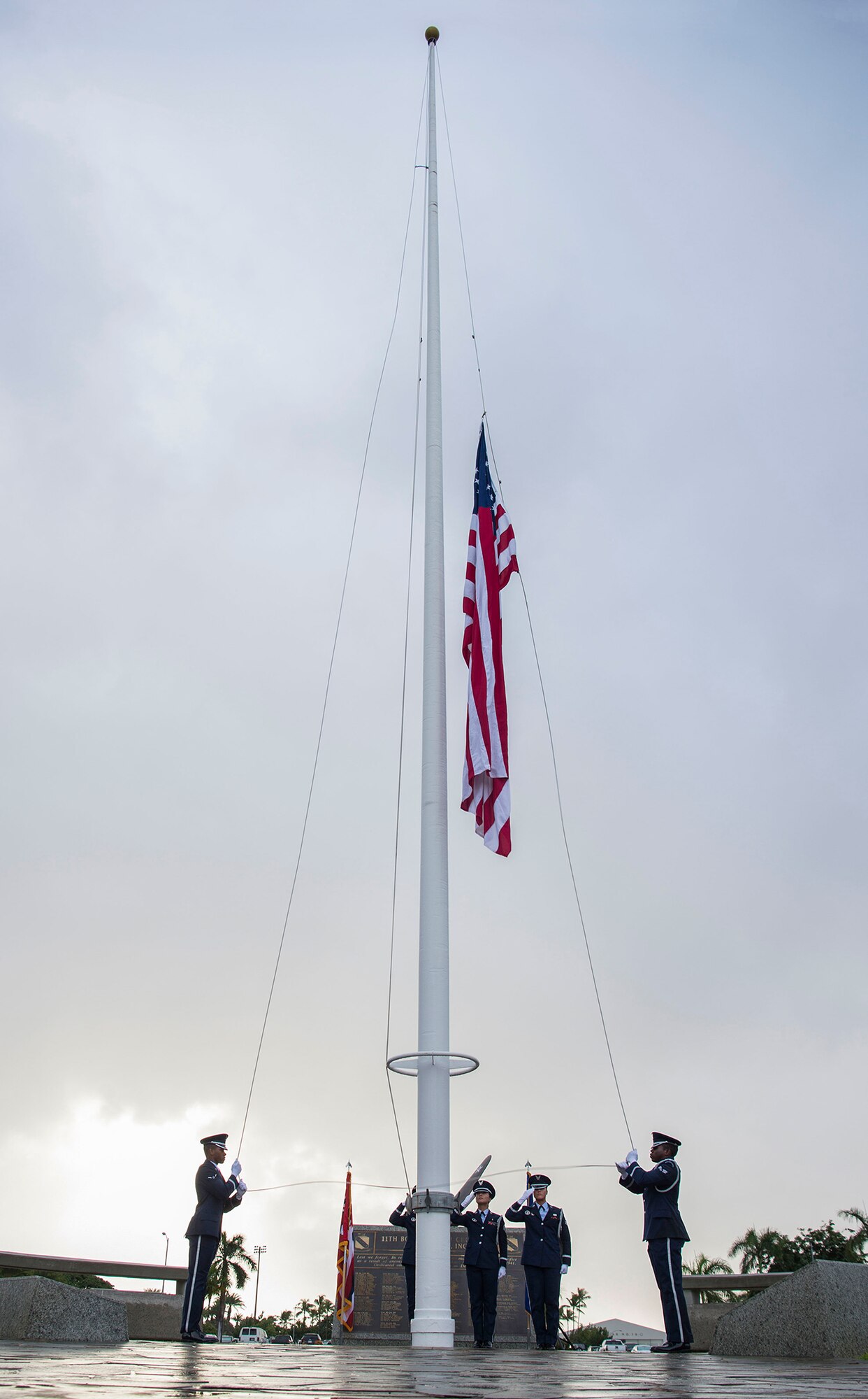 Members of the 15th Wing Honor Guard raise the flag during the Hickam Field Dec. 7th Remembrance Ceremony at Atterbury Circle, Joint Base Pearl Harbor-Hickam, Hawaii, Dec. 7, 2018. Over 100 military members, veterans and family members attended the ceremony to honor and remember the Airmen who lost their lives during the two waves of attacks by Japan on Dec. 7, 1941. (U.S. Air Force photo by Tech. Sgt. Heather Redman)