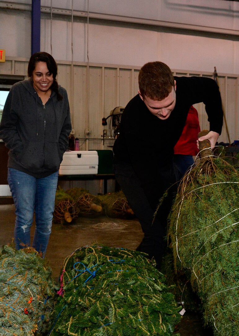 Specialist Barbar Fretto, with the Army Reserve and her husband Nicholas, an Army cadet, look for tree a to celebrate their first Christmas as husband and wife during the Trees for Troops event at Joint Base San Antonio-Randolph, Texas, Dec. 7, 2018. Trees for Troops has impacted many families and individuals.