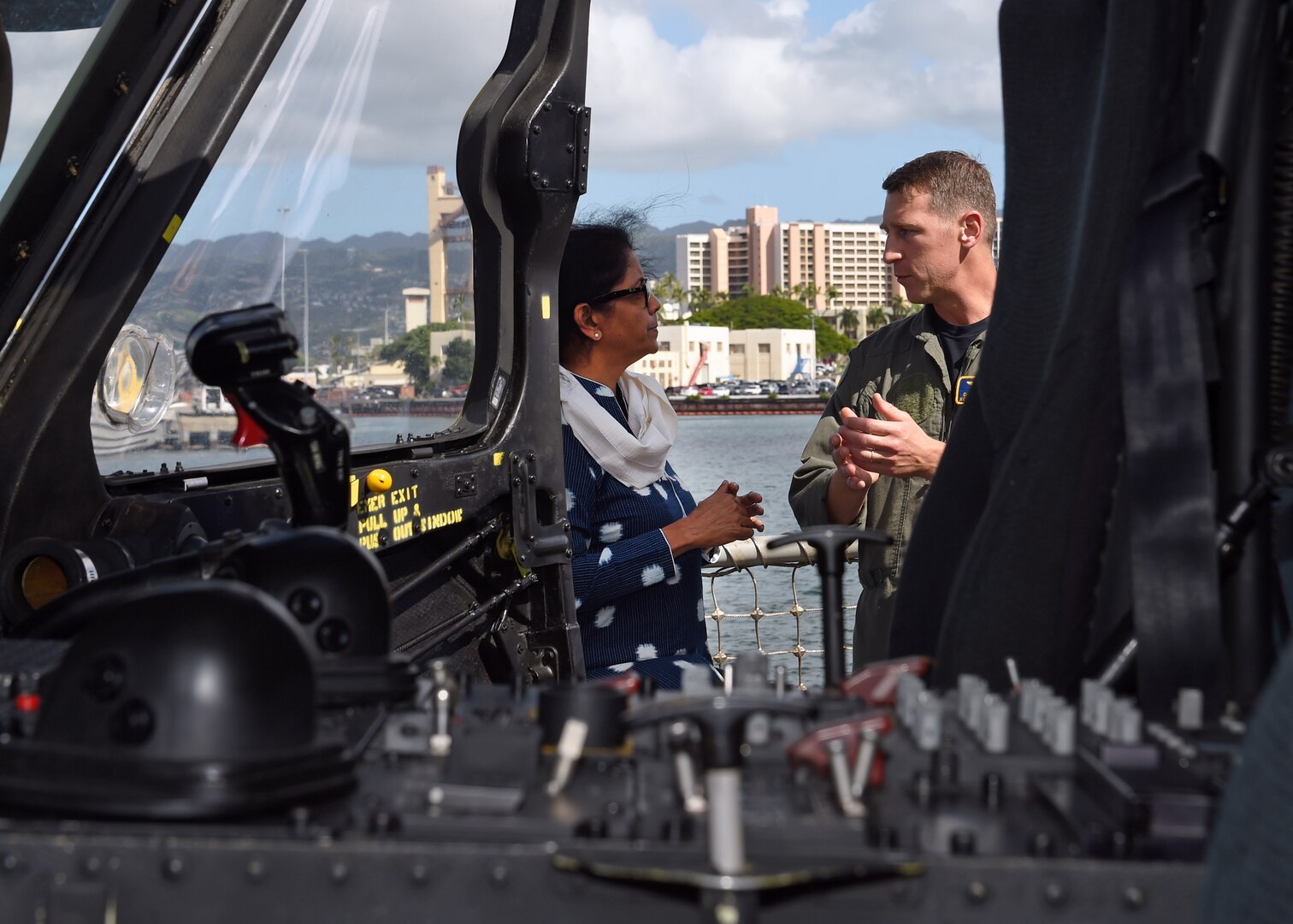 Cmdr. Daniel M. Martins, Executive Officer of  the Easyriders Helicopter Maritime Strike Squadron Three Seven (HSM-37), briefs India's Minister of Defence, Nirmala Sitharaman during a tour abroad the USS Michael Murphy. India and the U.S. are global partners in defense and security and are working together to assure a free and open Indo-Pacific.