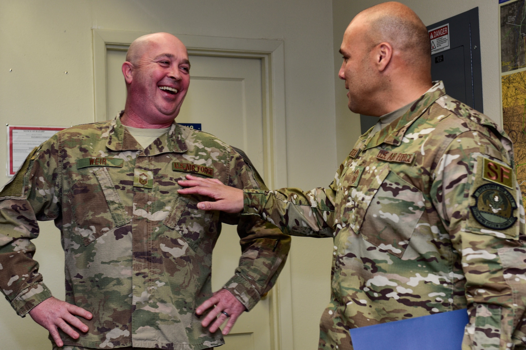 Chief Master Sgt. Roberto Arteaga, 377th Weapons System Security Squadron security forces manager, welcomes Senior Master Sgt. William Weir, 377th Maintenance Squadron superintendent, to the Kirtland Chief’s Group at Kirtland Air Force Base, N.M., Dec. 6, 2018. The Air Force selected 479 senior master sergeants for promotion to chief master sergeant out of 2,241 eligible with a selection rate of 21.37 percent for this promotion cycle. (U.S. Air Force photo by Airman 1st Class Austin J. Prisbrey)