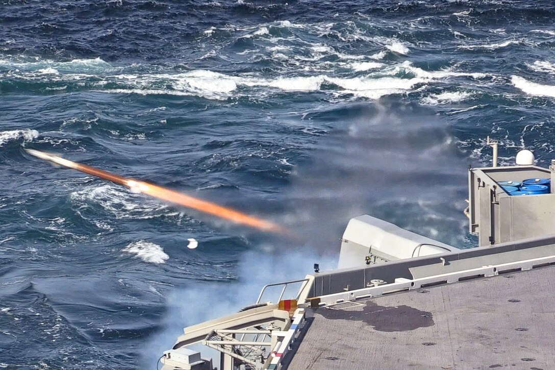 A missile fires from a ship.