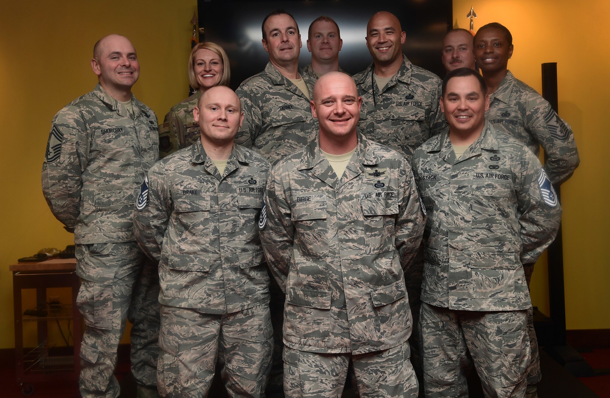 From left to right in front row, Senior Master Sgts. Joseph Drake, J. Dale Birge, and Edward Sostack, all chief master sergeant selects, stand among Team Buckley’s chief master sergeants during the release party at Buckley Air Force Base, Colo., Dec. 6, 2018.