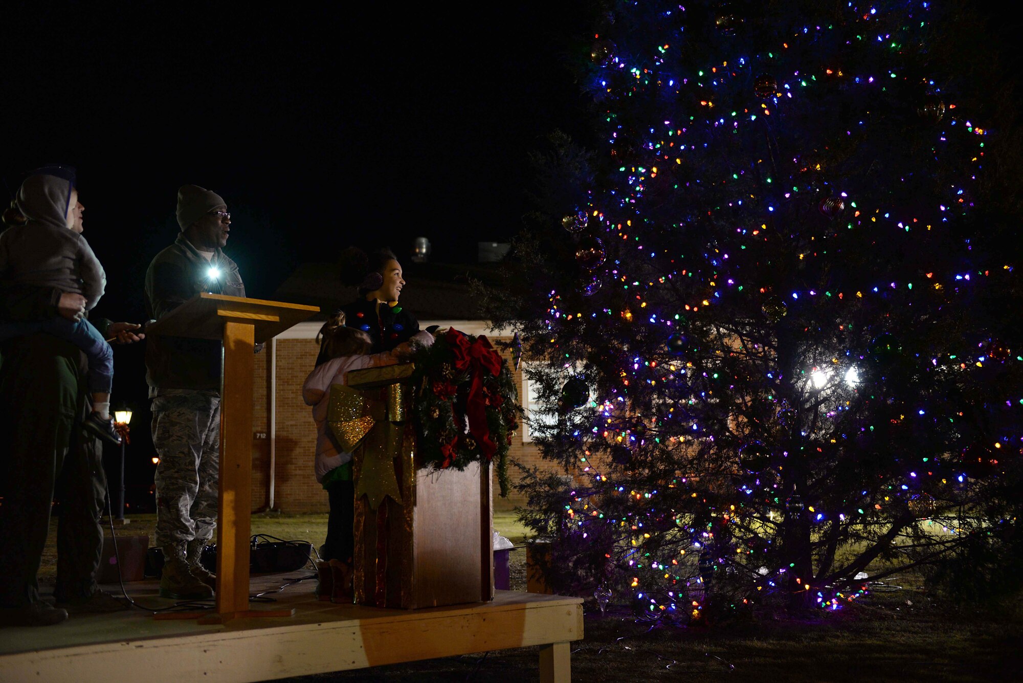 Family members of a deployed Airman from Columbus Air Force Base lit the tree during the Base Christmas Tree Lighting, Dec. 4, 2018, at the BLAZE Chapel here. After the lighting, children had the opportunity to have their photo taken with Santa in the Kaye Auditorium. (U.S. Air Force photo by Airman Hannah Bean)