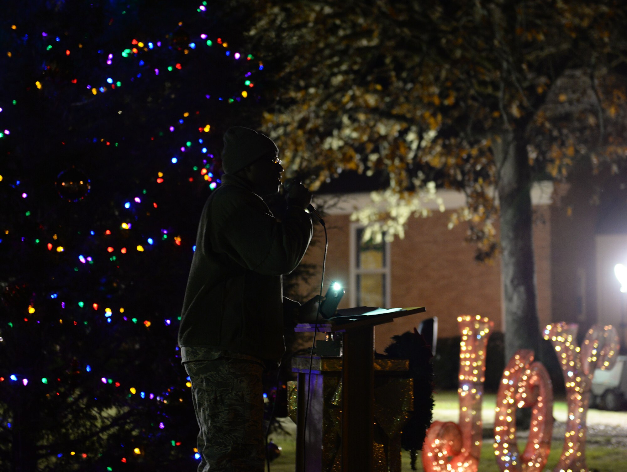 Chaplain (Capt.) Timme Henson, 14th Flying Training wing chaplain, introduces the 14th FTW commander and welcomes Team BLAZE during the base tree lighting Dec. 4, 2018, on Columbus Air Force Base, Mississippi. Team BLAZE lit the tree and the third light of the base menorah to begin the holiday season. (U.S. Air Force photo by Airman Hannah Bean)