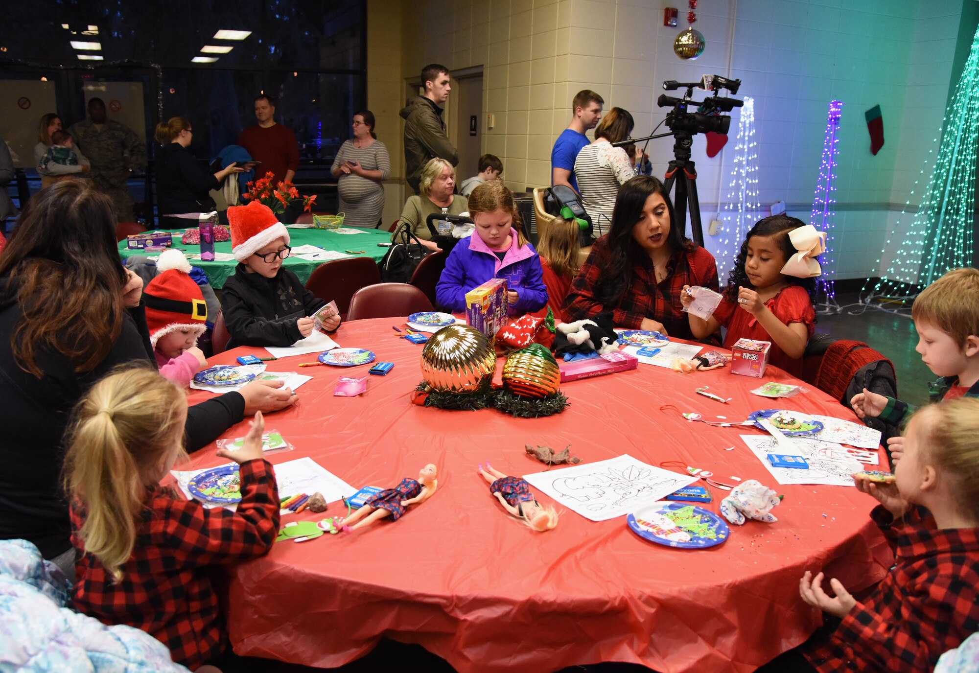 Keesler personnel attends Christmas in the Park at Keesler Air Force Base, Mississippi, Dec. 6, 2018. The event hosted by Outdoor Recreation included cookie and ornament decorating, games and visits with Santa. (U.S. Air Force photo by Kemberly Groue)