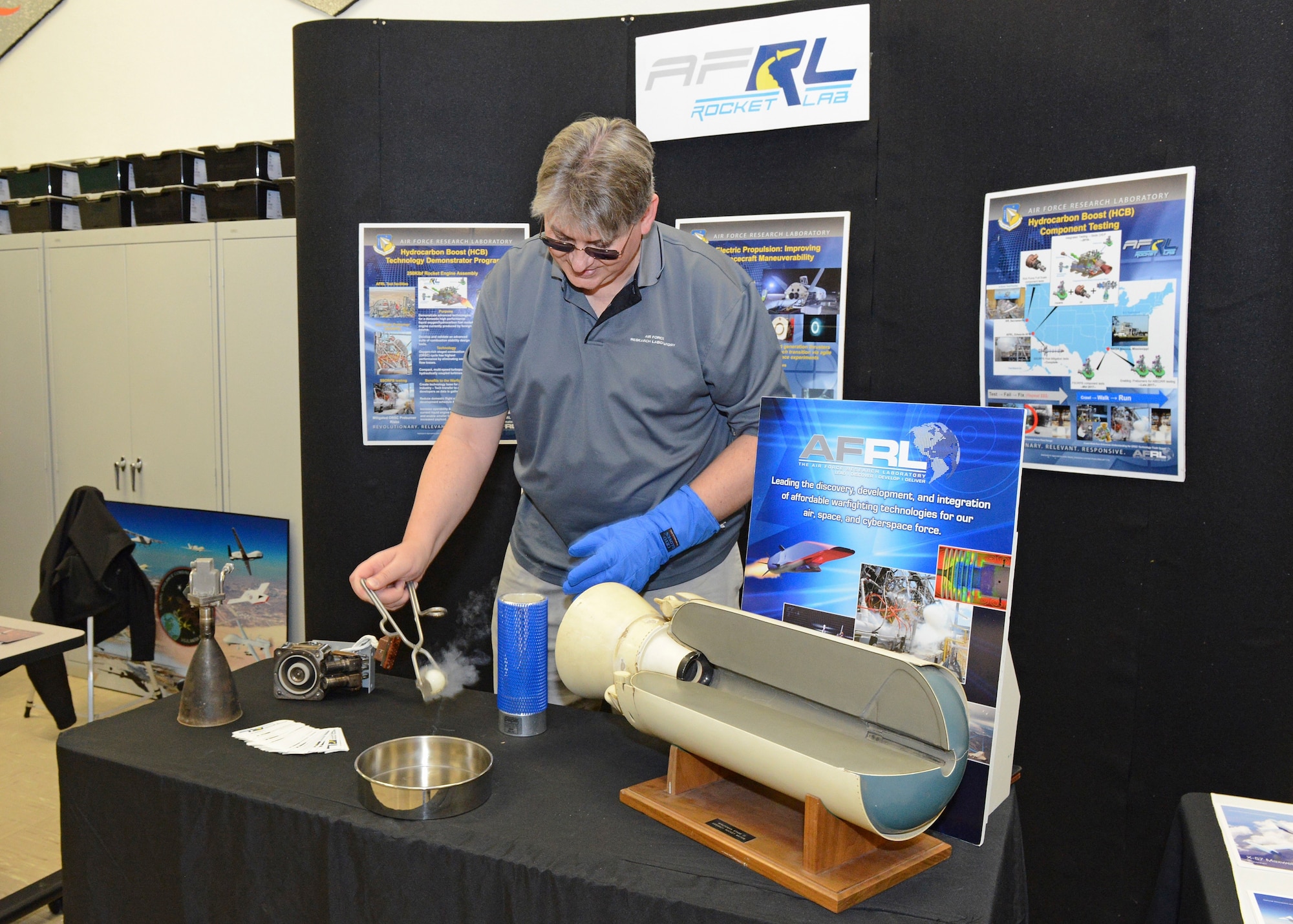 Kriss Vanderhyde, Air Force Research Labaratory Det. 7 Education Outreach manager, provides a simple propulsion demonstration following the grand opening of STARBASE at Branch Elementary on Edwards Air Force Base Dec. 7. The Department of the Defense STARBASE program aims at giving students a hands-on learning experience in the science, technology, engineering and mathematics fields. (U.S. Air Force photo by Kenji Thuloweit)