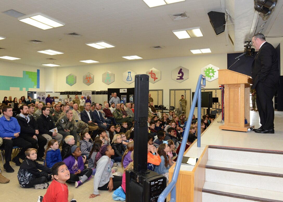 Mike O’Toole of the Department of Defense STARBASE program (right) addresses students and guests at the new STARBASE building at Branch Elementary at Edwards Air Force Base Dec. 7. The base held a grand opening for the educational program aimed at giving students a hands-on learning experience in the science, technology, engineering and mathematics fields. (U.S. Air Force photo by Kenji Thuloweit)
