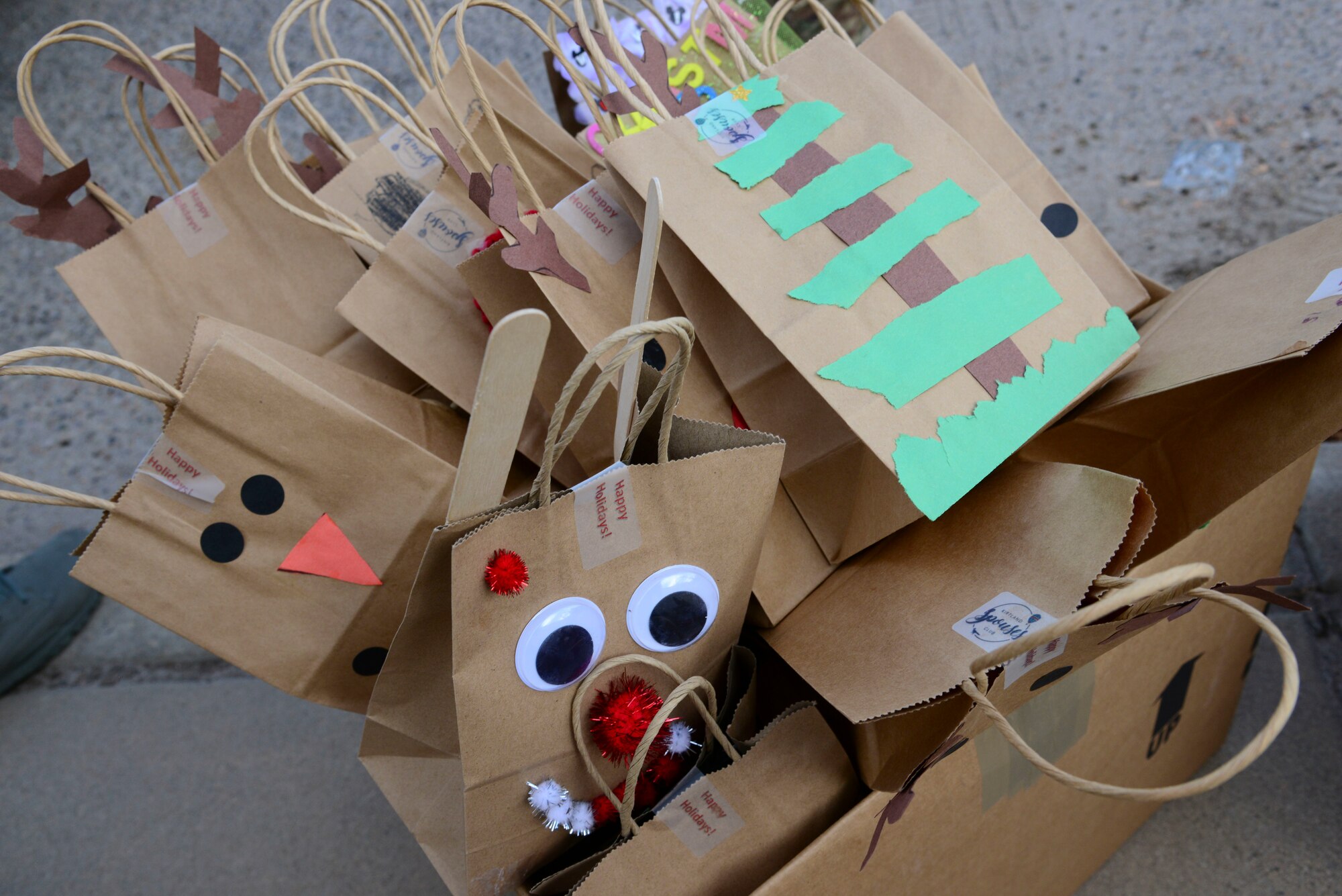 Seven hundred and eight-two dozen cookies were baked, donated, and/or collected and coordinated by the Kirtland Spouses Club Dec. 5 and 6. They were then delivered by the First Sergeants Council and additional volunteers to dormitory residents Dec. 6. The annual cookie drive, a tradition kept alive year after year by the work of the Spouses Club, ensures that Airmen living in the dormitories have homemade holiday treats. More than 30 Spouses Club members were joined by active duty volunteers to collect and package the cookies. (Photos by Jessie Perkins)