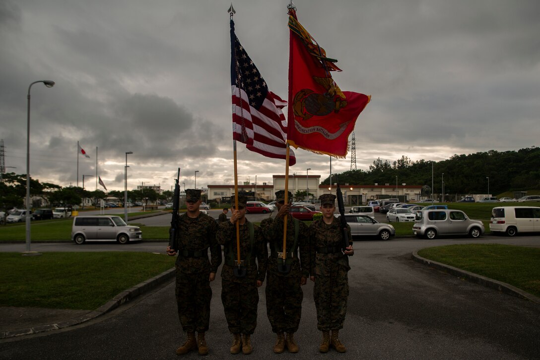 Marines with the color guard prepare to march forward at the start of the Defense Cyberspace Operations Internal Defense Measures Company activation ceremony at Camp Hansen, Okinawa, Japan, Dec. 7, 2018. Lt. Col. Michael Hlad, the battalion commander of 7th Communication Battalion, served as the reviewing officer during the ceremony. DCO-IDM Company is III MEF Information Group’s first line of defense against cyber-attacks in the Indo-Pacific region. The Marines are with 7th Communication Battalion, III Marine Expeditionary Force Information Group. (U.S. Marine Corps photo by Cpl. Alexis B. Betances)