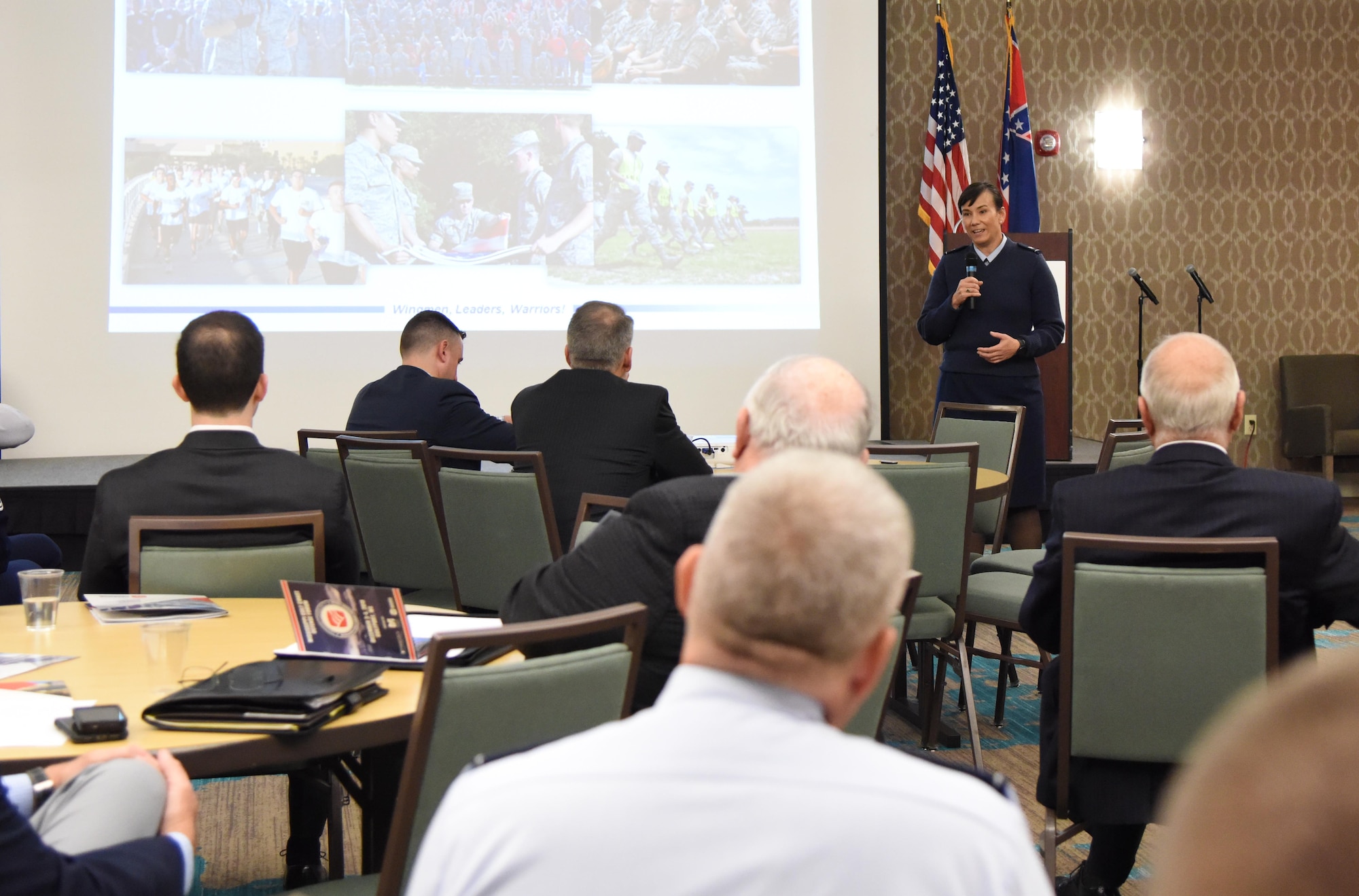 U.S. Air Force Col. Debra Lovette, 81st Training Wing commander, delivers the 81st TRW mission briefing during the Mississippi Gulf Coast Defense Forum inside the Courtyard by Marriott Gulfport Beachfront in Gulfport, Mississippi, Dec. 3, 2018. The two-day forum is a product of the Association of Defense Communities, an organization focused on advancing community-military partnerships that promote the value of military installations, strengthen communities and states through collaborative relationships and sustainable regional planning. (U.S. Air Force photo by Kemberly Groue)