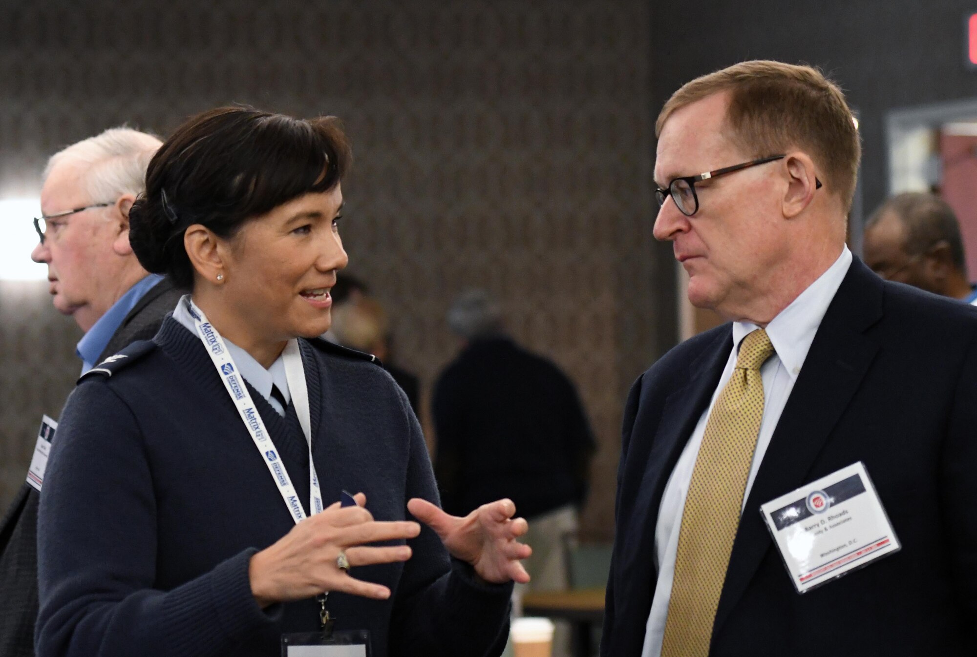 U.S. Air Force Col. Debra Lovette, 81st Training Wing commander, engages in discussion with Barry Rhoads, Cassidy and Associates chairman, during the Mississippi Gulf Coast Defense Forum inside the Courtyard by Marriott Gulfport Beachfront in Gulfport, Mississippi, Dec. 3, 2018. The two-day forum is a product of the Association of Defense Communities, an organization focused on advancing community-military partnerships that promote the value of military installations, strengthen communities and states through collaborative relationships and sustainable regional planning. (U.S. Air Force photo by Kemberly Groue)