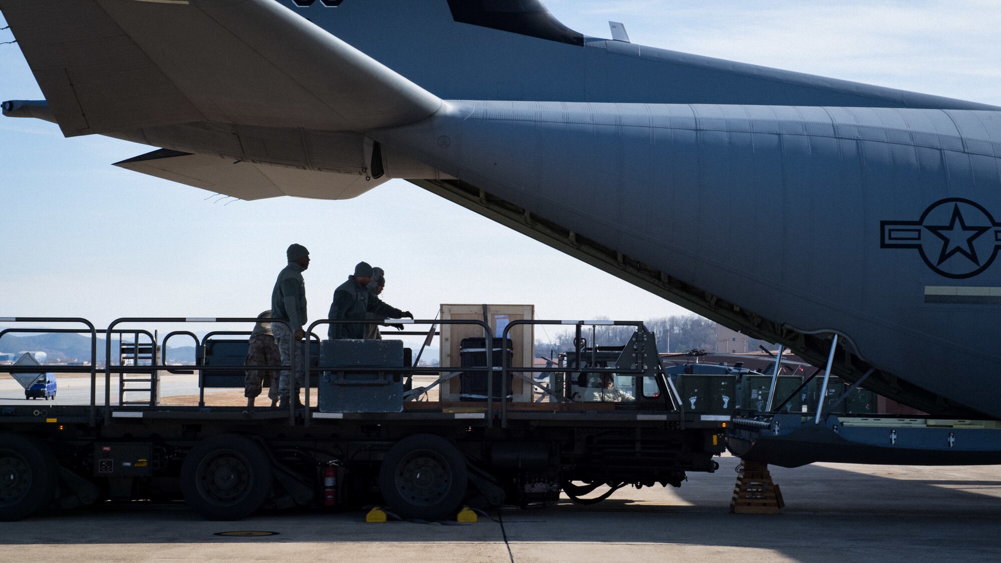 A C-130J Super Hercules departs Osan Air Base, Republic of Korea, transporting a Balangiga Bell to Kadena Air Base, Japan, Dec. 7, 2018. The 51st Logistics Readiness Squadron was called on by Pacific Air Forces to create a special airlift mission to support the U.S. Army’s shipment of the bell. (U.S. Air Force photo by Staff Sgt. Benjamin Raughton)