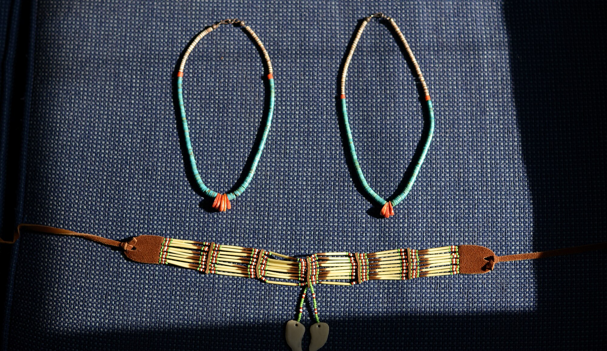 Traditional native american jewelry is laid out on the couch of Airman 1st Class Phillip E. Rock.