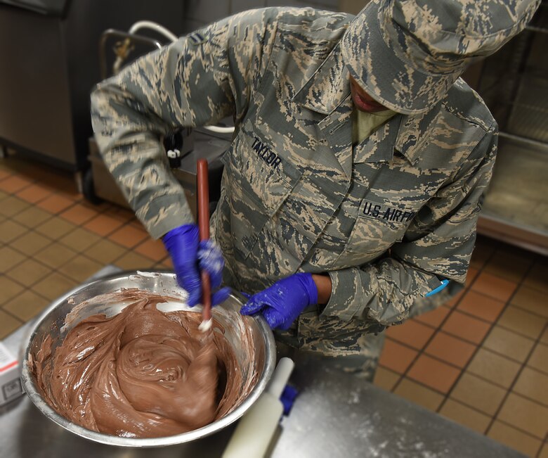 Airman 1st Class Alexis M. Taylor makes pudding.