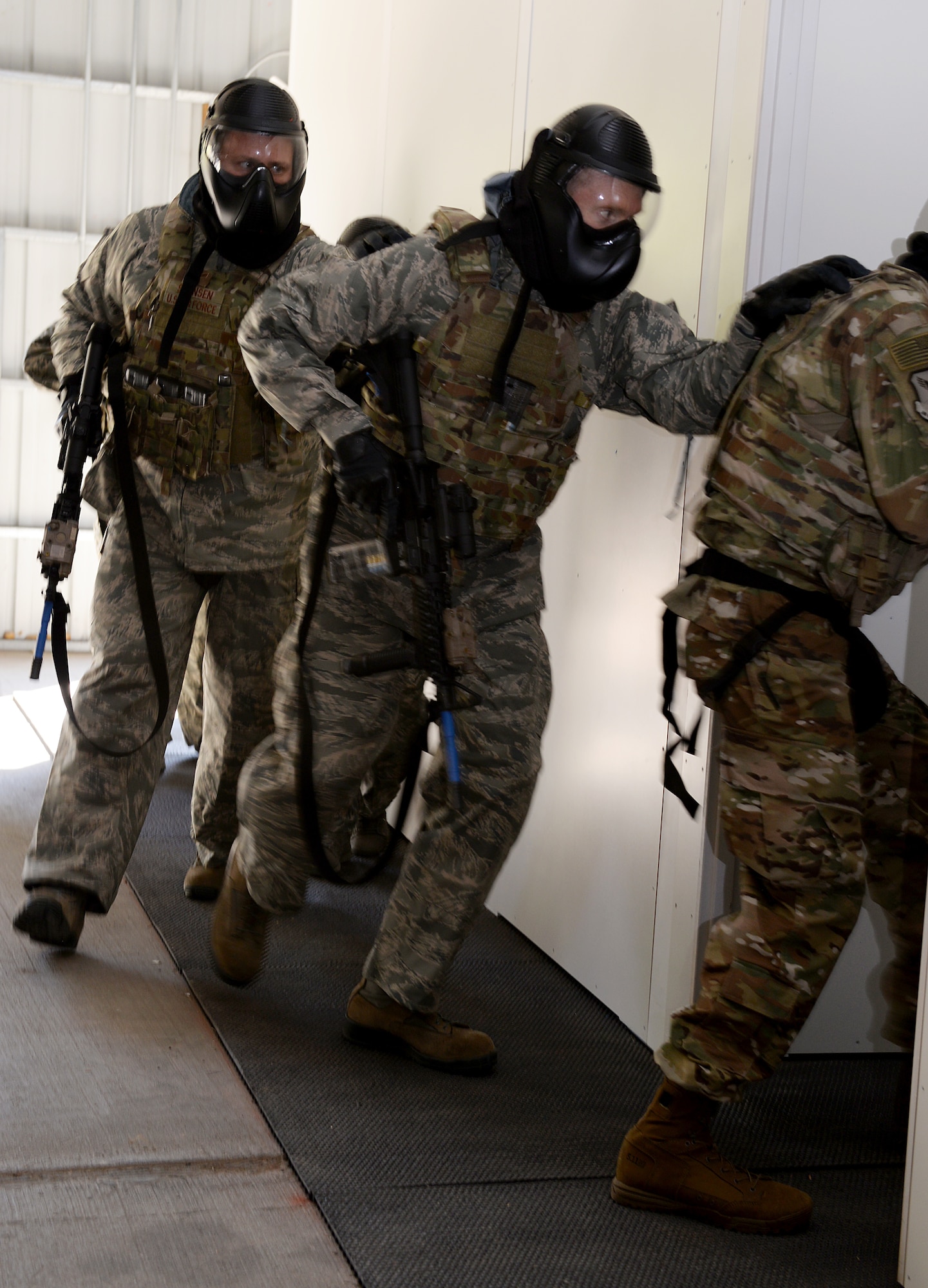 Maj. Gen. James C. Dawkins Jr., Eighth Air Force commander, and Brig. Gen. John J. Nichols, 509th Bomb Wing commander, stack against a shoot house wall during a room-clearing demonstration.