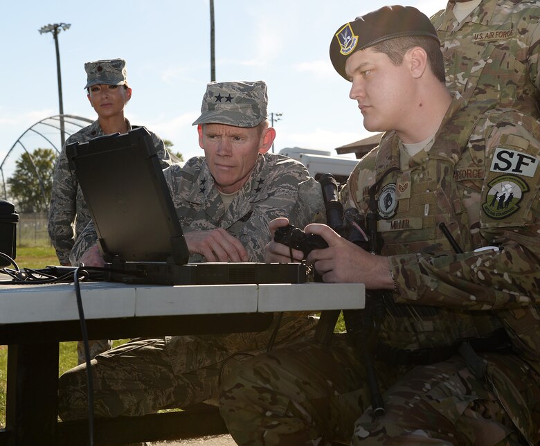 Staff Sgt. Aaron D. Miller, assigned to the 509th Security Forces Squadron, shows an anti-drone computer program to Maj. Gen. James c. Dawkins Jr., Eighth Air Force commander.