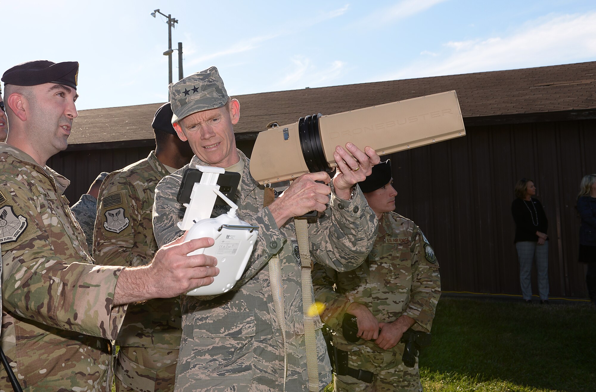 Maj. Gen. James C. Dawkins Jr., Eighth Air Force commander, learns about anti-drone technology from Master Sgt. Christopher S. Camara.