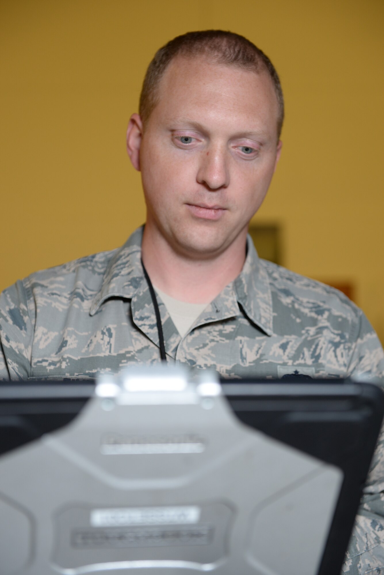 Staff Sgt. James B. Finn, a signature diagnostics technician assigned to the 509th Bomb Wing, processes the results of his inspection of a B-2 Stealth Bomber.