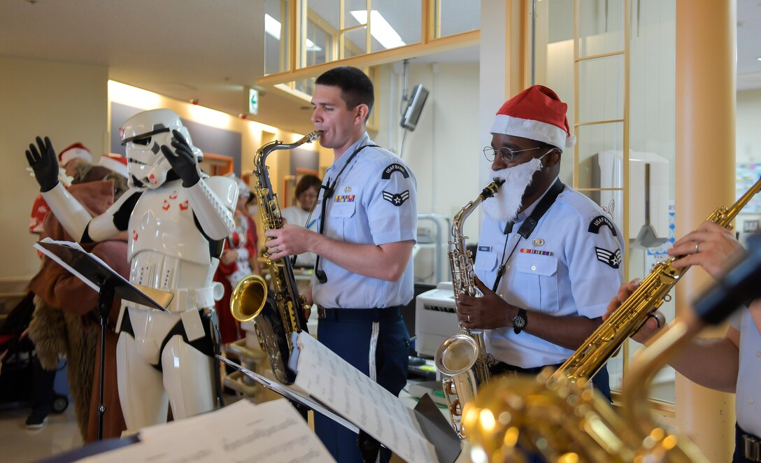 U.S. Air Force Band of the Pacific members play holiday music