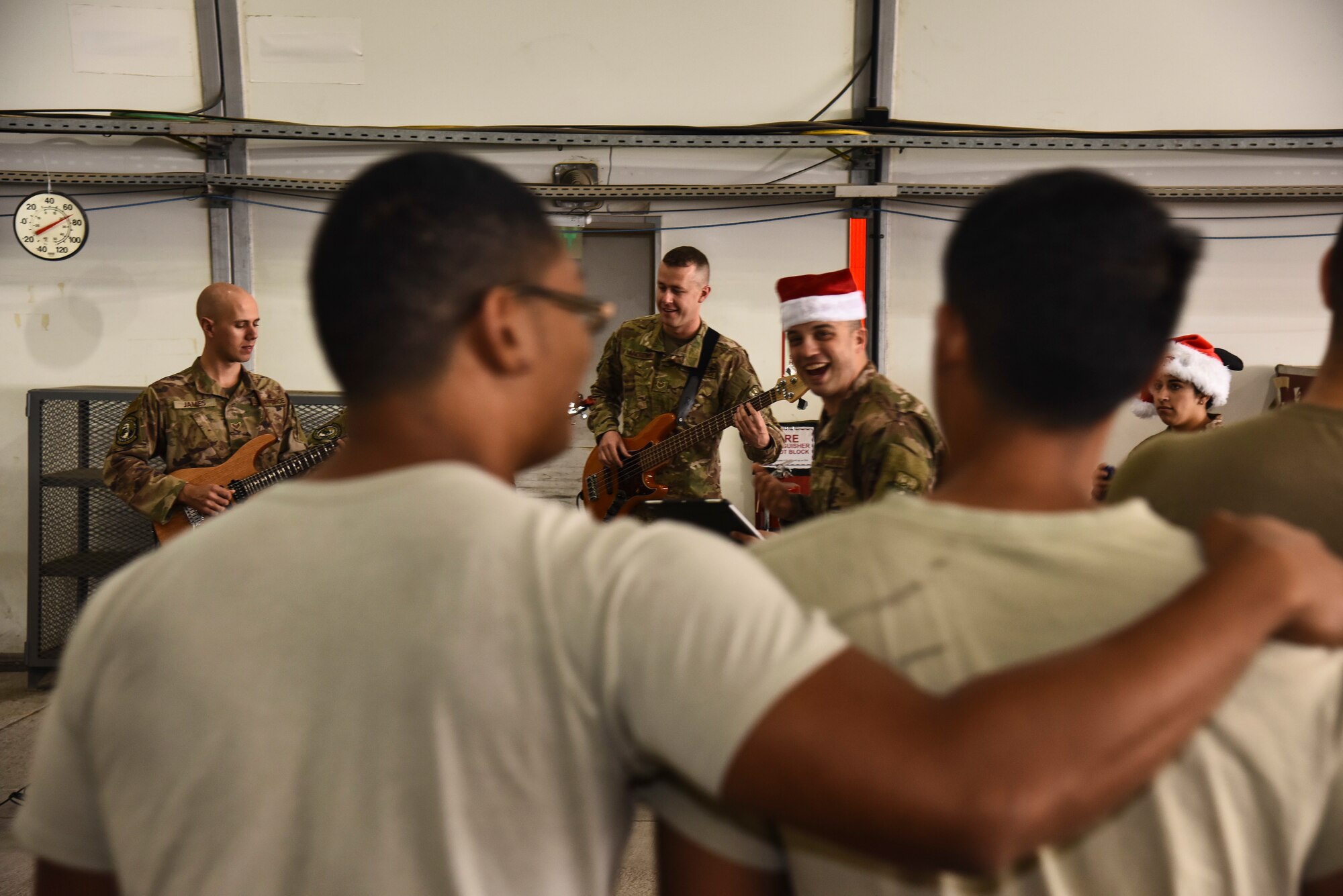 The U.S. Air Forces Central Command Band performs for Airmen assigned to the 380th Expeditionary Maintenance Group at Al Dhafra Air Base, United Arab Emirates, Dec. 4, 2018. The AFCENT Band rotates several ensembles through the area of responsibility that perform a wide variety of musical styles to appeal to audiences of all ages and backgrounds. (U.S. Air Force photo by Senior Airman Mya M. Crosby)