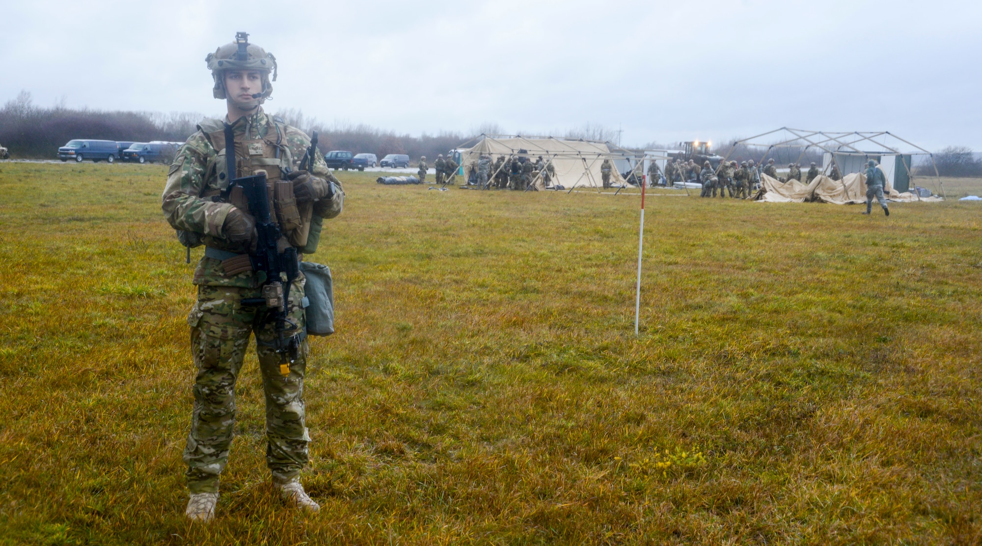 A U.S. Airmen assigned to the 435th Contingency Response Group, 435th Air Ground Operations Wing, Ramstein Air Base, Germany, stands guard during exercise Contested Forge on Grostenquin Air Base, France, Dec. 3, 2018. As part of Contested Forge, Airmen assigned to the 435th CRG practiced their capability to set up, conduct, and defend austere airfield operations and a bare base. (U.S. Air Force photo by Staff Sgt. Timothy Moore)