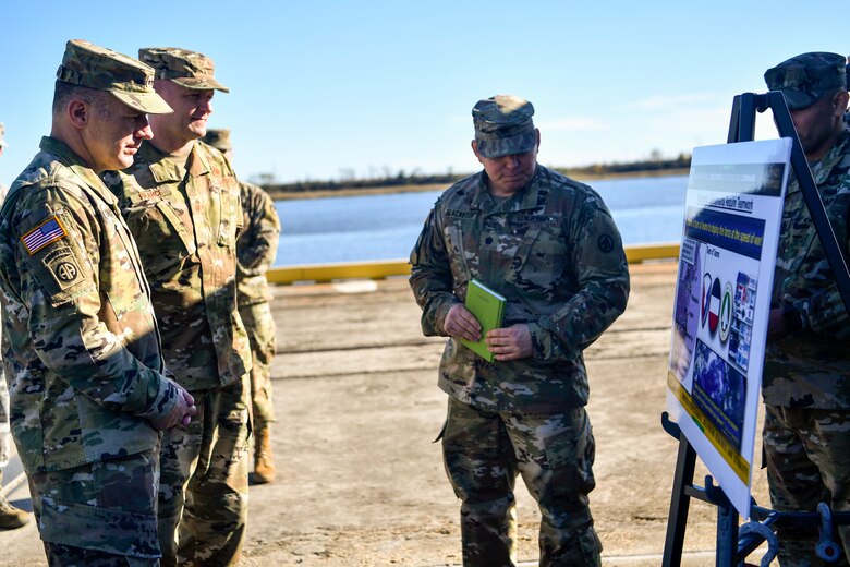 Army Gen. Stephen Lyons, commander of U.S. Transportation Command, listens to a presentation from the 841st Transportation Battalion Dec. 6, 2018, at Joint Base Charleston, S.C.