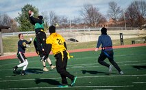 Army 1st  Lt. Deon Evans, U.S. Transportation Command J1 executive officer, catches a football during USTRANSCOM’s Army vs. Navy football game at Scott Air Force Base, Illinois, Nov. 26, 2018. The Army won the game 44 to 32.
