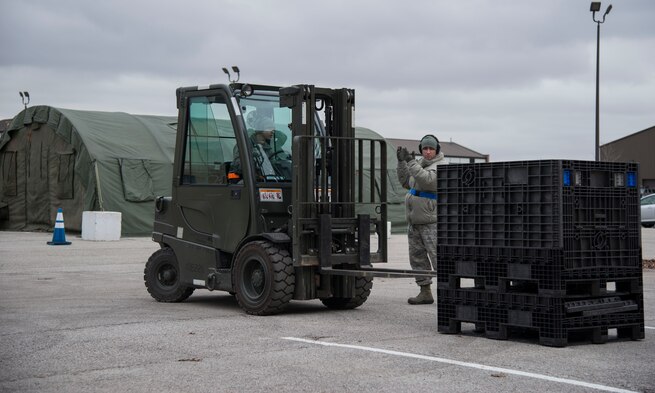 Airmen from the 375th Logistics Readiness Squadron load a forklift with a pallet of supplies at Scott AFB, Ill. Dec. 3, 2018. Phase I of the MOBEX is making sure that Airmen have all the necessary supplies to deploy.