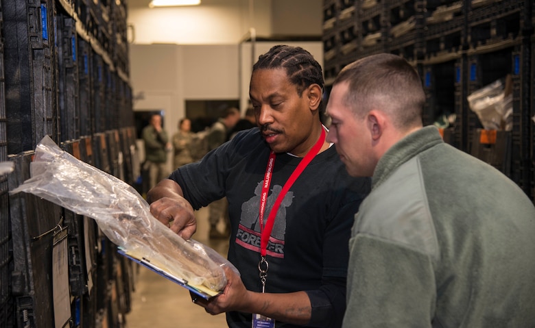 Mark Lawrence, 375th Logistic Readiness Squadron material handler, issues deployment equipment during a mobility exercise, Dec. 4, 2018, at Scott Air Force Base, Illinois. The 375th LRS issue all the equipment necessary for deploying Airmen.