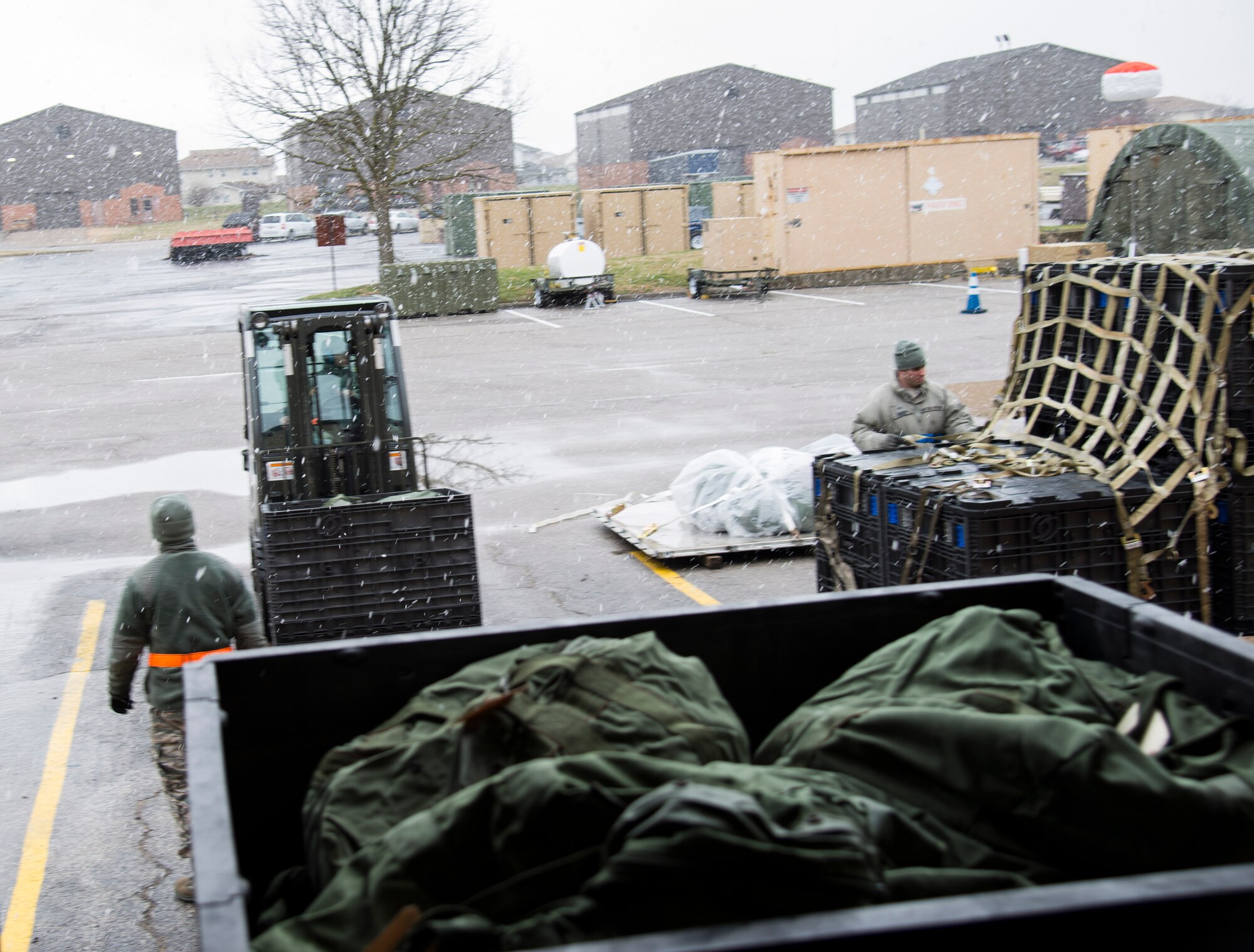 Members of the 375th Logistics Readiness Squadron unload pallets of issued equipment during a mobility exercise, Dec. 4, 2018, at Scott Air Force Base, Illinois. During the first phase of the MOBEX, Airmen are given the necessary equipment to deploy.