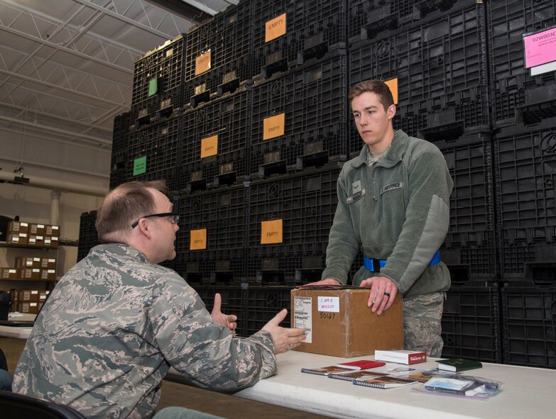 Airman 1st Class Eric Renner, 375th Operations Support Squadron, proceeds through the pre-deployment function line during a mobility exercise, Dec. 4, 2018, at Scott Air Force Base, Illinois. During the MOBEX, Airmen are given the necessary information from the chaplain, finance, and other agencies from the 375th Air Mobility Wing.