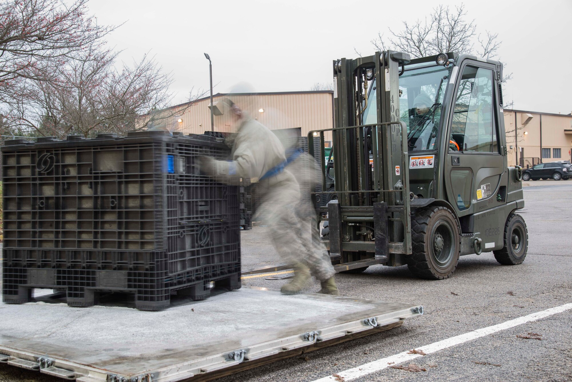 Staff Sgt. Christopher Britt, 375th Logistic Readiness Squadron data records custodian, and Airman 1st Class Eliezer Rivera, 375th LRS ground transportation, move a pallet full of equipment during a mobility exercise, Dec. 4, 2018, at Scott Air Force Base, Illinois. During the exercise, the 375th LRS makes sure that Airmen are issued all the necessary equipment to deploy.