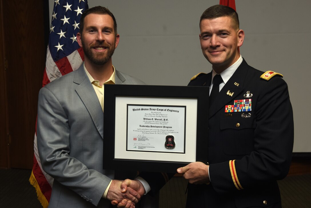 Lt. Col. Cullen Jones, U.S. Army Corps of Engineers Nashville District commander, presents a graduation diploma for the 2018 Leadership Development Program Level II Course to William Worrall during a graduation ceremony Dec. 4, 2018 at the Scarritt Bennett Center in Nashville, Tenn. (USACE Photo by Lee Roberts)