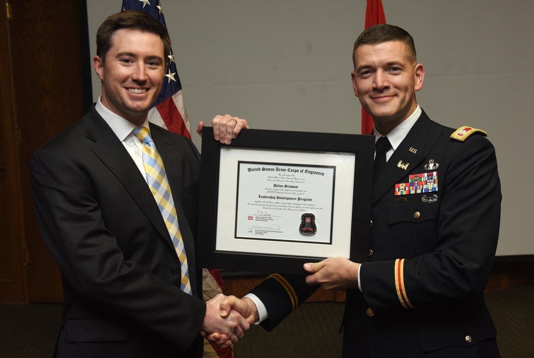 Lt. Col. Cullen Jones, U.S. Army Corps of Engineers Nashville District commander, presents a graduation diploma for the 2018 Leadership Development Program Level II Course to Dylan Grissom during a graduation ceremony Dec. 4, 2018 at the Scarritt Bennett Center in Nashville, Tenn. (USACE Photo by Lee Roberts)