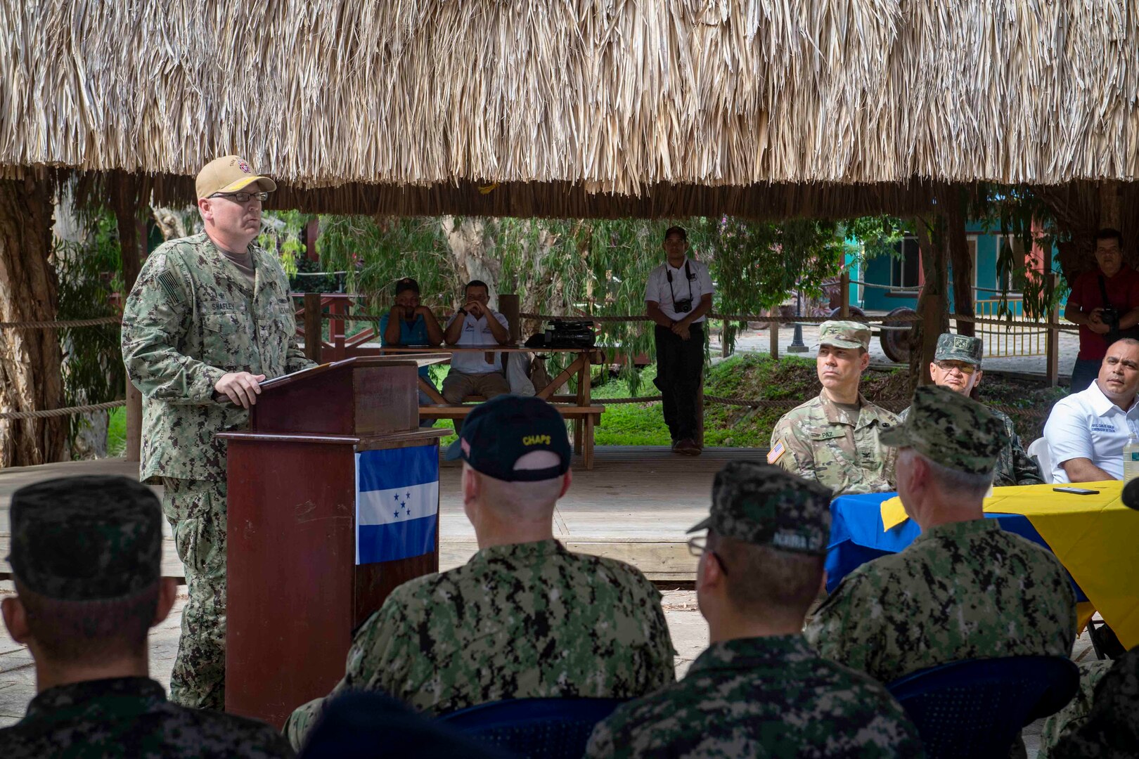 Capt. William Shafley, commanding officer, Task Force 49, delivers remarks during the opening ceremony held at one of two medical sites.