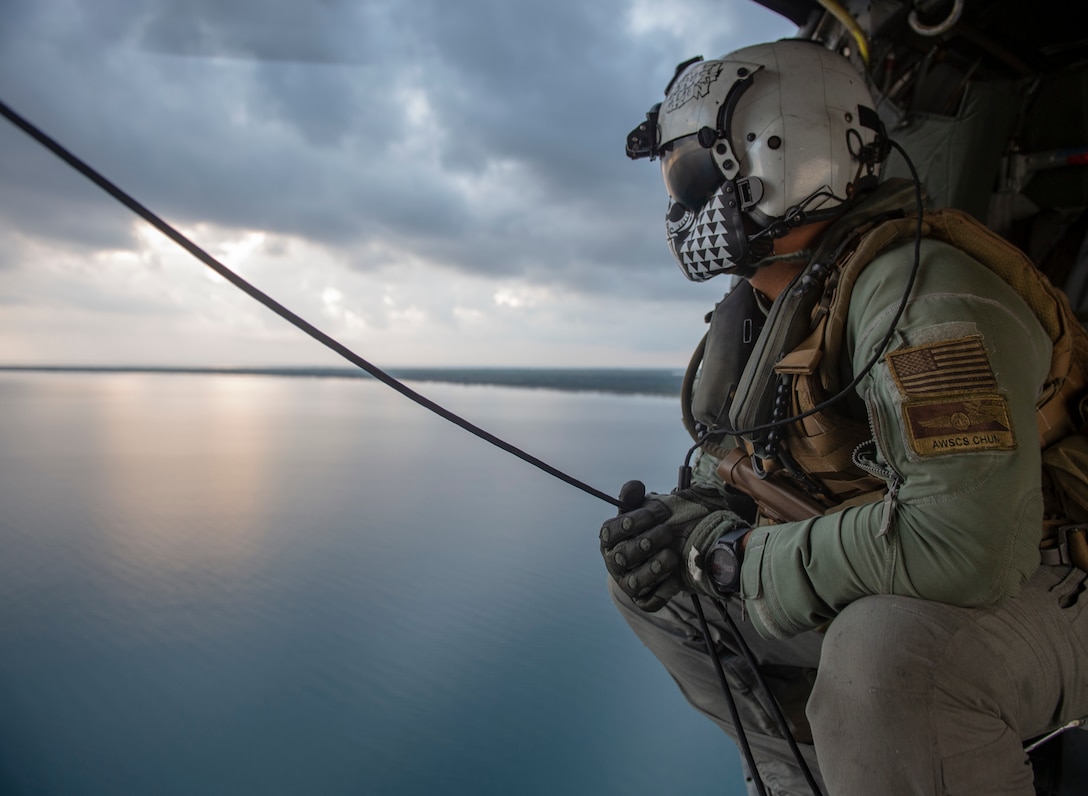 Senior Chief Naval Aircrewman (Helicopter) Scott Chun, from Honolulu, conducts a survey of the Honduran airspace in preparation for vertical replenishment operations from aboard an MH-60S Seahawk, assigned to the “Sea Knights” of Helicopter Sea Combat Squadron (HSC) 22.