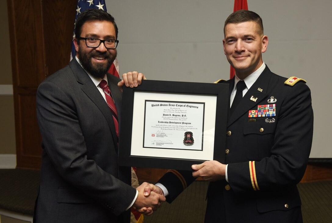 Lt. Col. Cullen Jones, U.S. Army Corps of Engineers Nashville District commander, presents a graduation diploma for the 2018 Leadership Development Program Level II Course to David Bogema during a graduation ceremony Dec. 4, 2018 at the Scarritt Bennett Center in Nashville, Tenn. (USACE Photo by Lee Roberts)