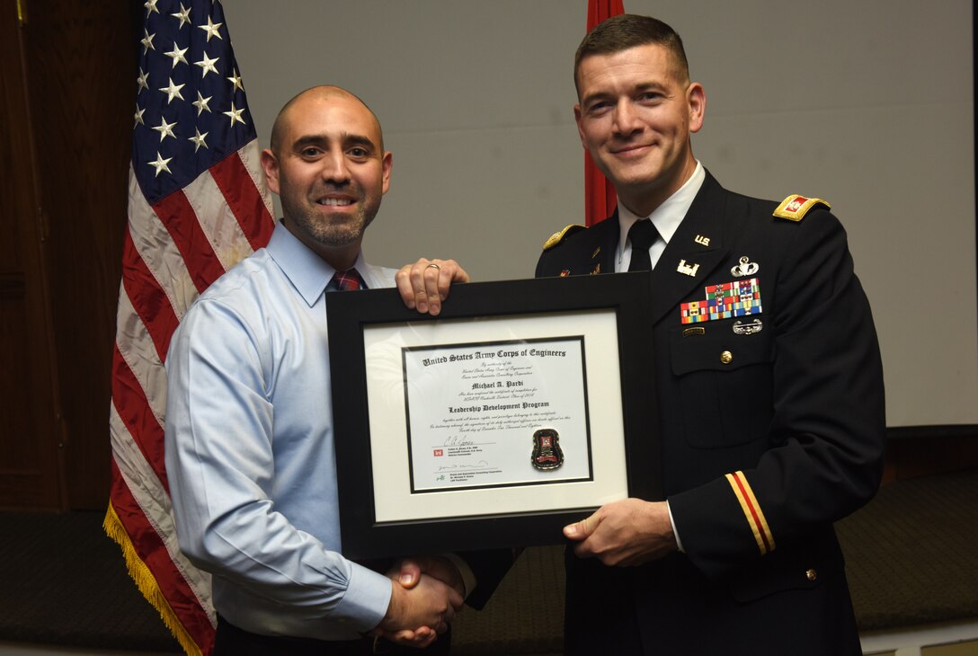 Lt. Col. Cullen Jones, U.S. Army Corps of Engineers Nashville District commander, presents a graduation diploma for the 2018 Leadership Development Program Level II Course to Michael Pardi during a graduation ceremony Dec. 4, 2018 at the Scarritt Bennett Center in Nashville, Tenn. (USACE Photo by Lee Roberts)