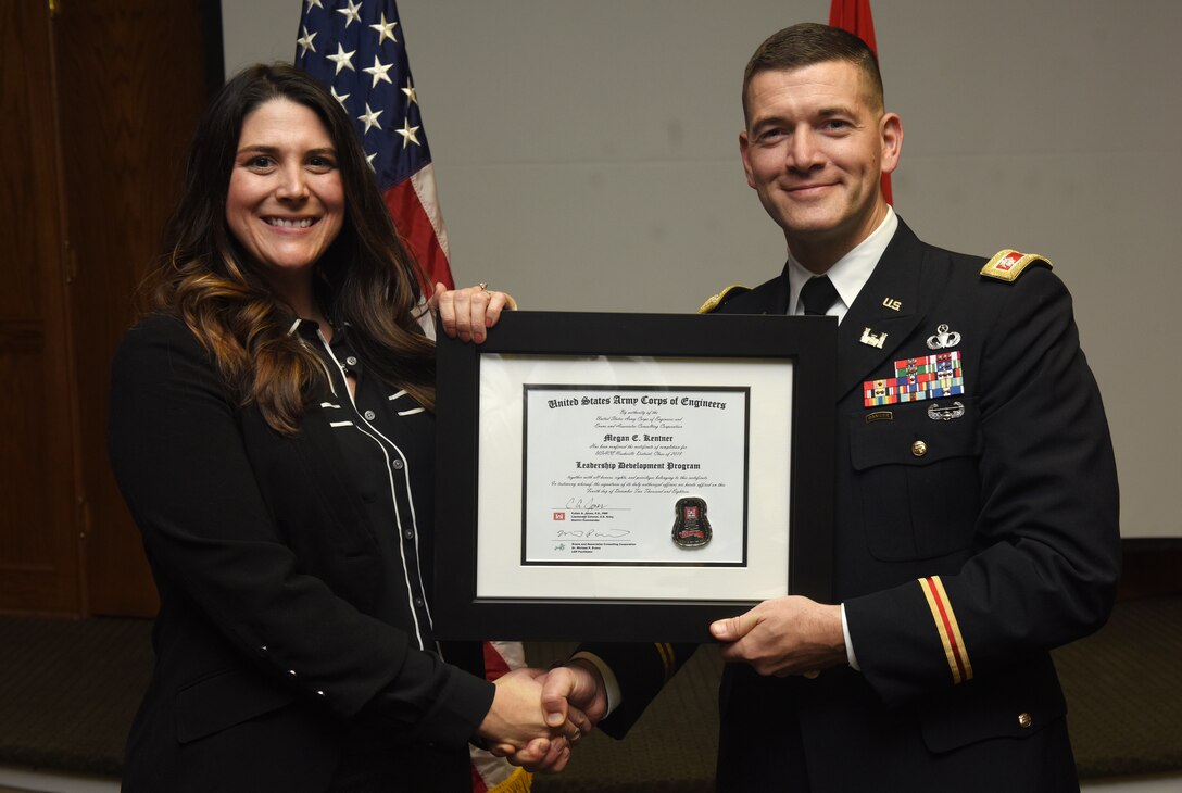 Lt. Col. Cullen Jones, U.S. Army Corps of Engineers Nashville District commander, presents a graduation diploma for the 2018 Leadership Development Program Level II Course to Megan Kentner during a graduation ceremony Dec. 4, 2018 at the Scarritt Bennett Center in Nashville, Tenn. (USACE Photo by Lee Roberts)