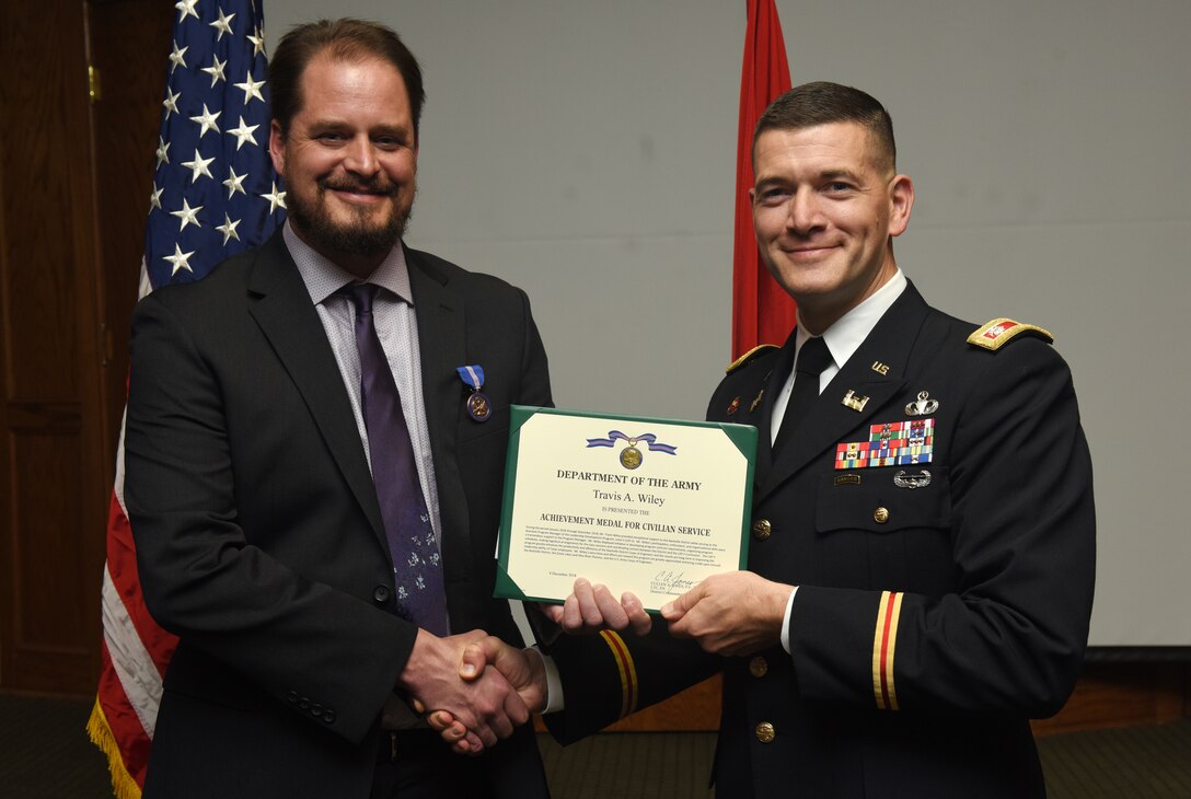 Lt. Col. Cullen Jones, U.S. Army Corps of Engineers Nashville District Commander, presents a certificate of appreciation Dec. 4, 2018 to Course Instructor Michael Evans for his leadership, knowledge, teaching skills, dedication to learning, and commitment to the Nashville District’s 2018 Leadership Development Program Level II Course during a graduation ceremony at the Scarritt Bennett Center in Nashville, Tenn. (USACE Photo by Lee Roberts)