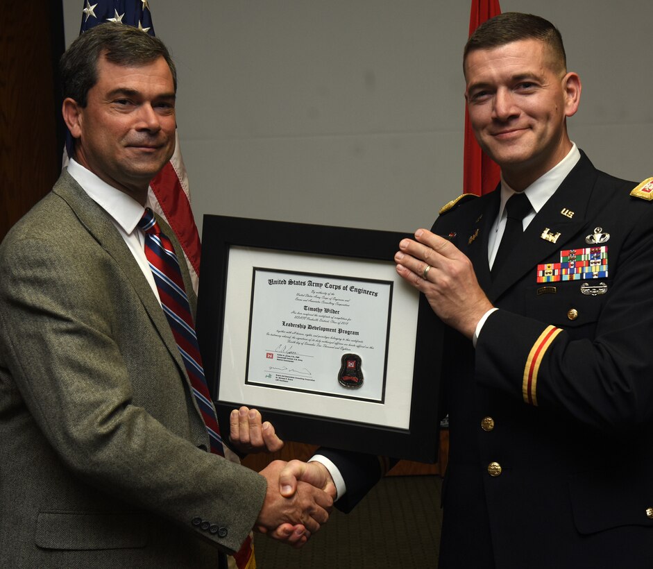 Lt. Col. Cullen Jones, U.S. Army Corps of Engineers Nashville District commander, presents a graduation diploma for the 2018 Leadership Development Program Level II Course to Tim Wilder during a graduation ceremony Dec. 4, 2018 at the Scarritt Bennett Center in Nashville, Tenn. (USACE Photo by Lee Roberts)