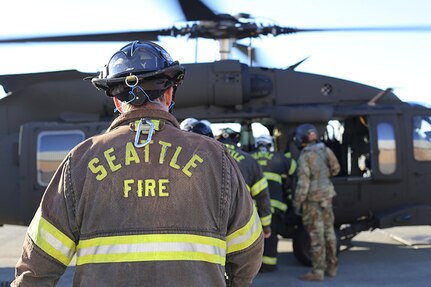 Members of the Seattle Fire Department participated in a training exercise with the Washington Army National Guard aviators doing personnel movement on UH-60 Black Hawk helicopters.