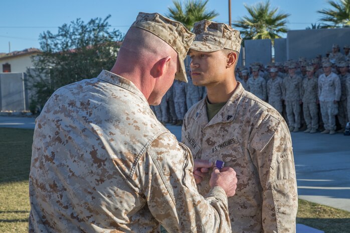 Cpl. Tyler A. Frazier, a mortar Marine with 3rd Battalion, 7th Marine Regiment, is awarded the Purple Heart Medal by Lt. Col. Steven M. Ford, commanding officer, 3/7 at Victory Field aboard the Marine Corps Air Ground Combat Center, Twentynine Palms, Calif., Nov. 7, 2018. Frazier was awarded the Purple Heart for injuries sustained in Syria while 3/7 was deployed with the Special Purpose Marine Air Ground Task Force-Crisis Response-Central Command.