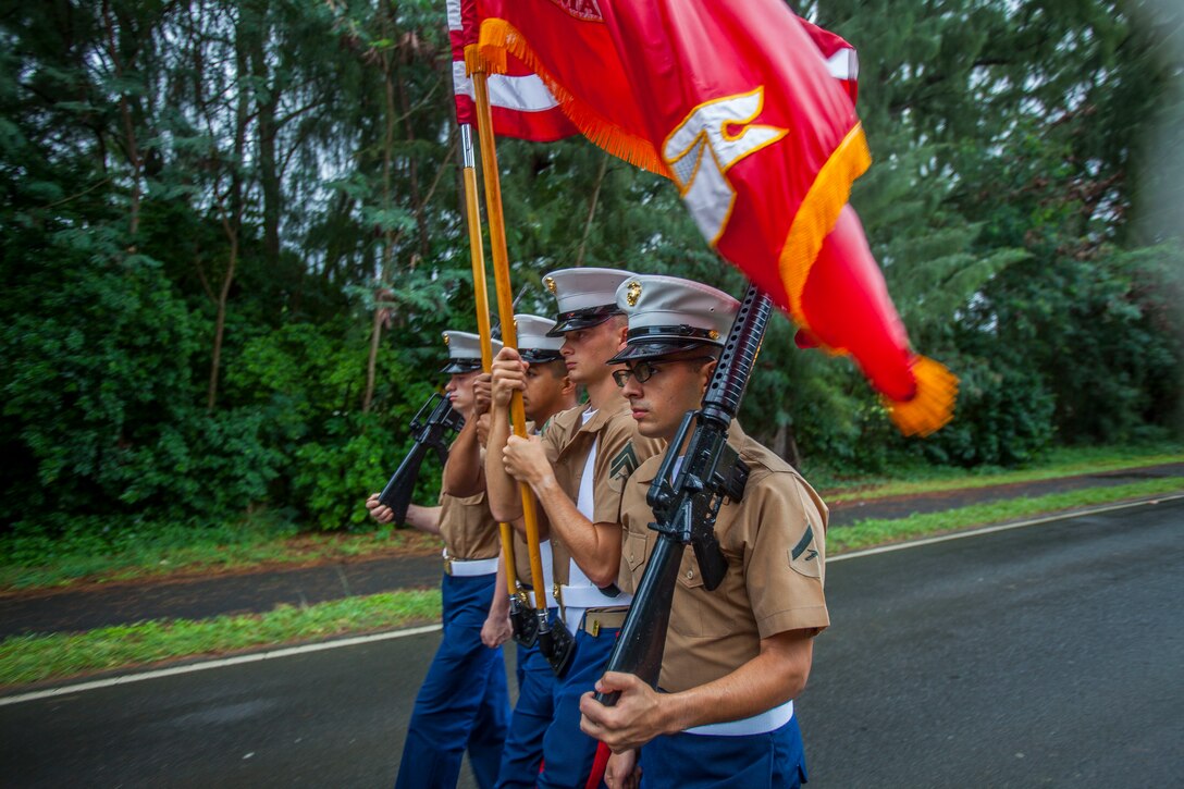 U.S. Marines with the Marine Aircraft Group 24 colorguard march during the 2018 Waimanalo Christmas Parade, Dec. 8, 2018. The parade is held annually and supported by U.S. Marines from Marine Corps Base Hawaii.
