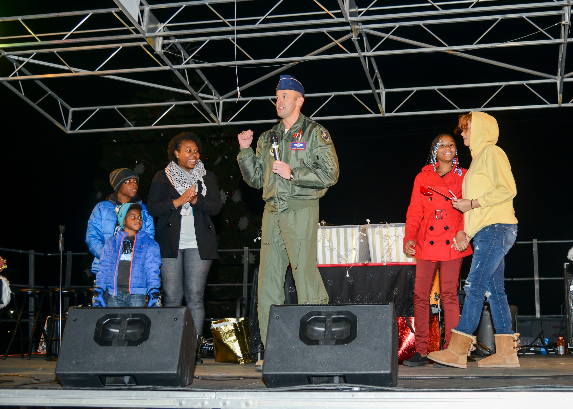412th Test Wing commander, Brig. Gen. E. John Teichert, welcomes members of the Edwards community as well as the Mackey family, a Gold Star Family, during Winterfest Edwards Air Force Base, California, Nov. 30. Winterfest is an annual event that allows members of the community to ring in the start of the holiday season. (U.S. Air Force photo by Giancarlo Casem)
