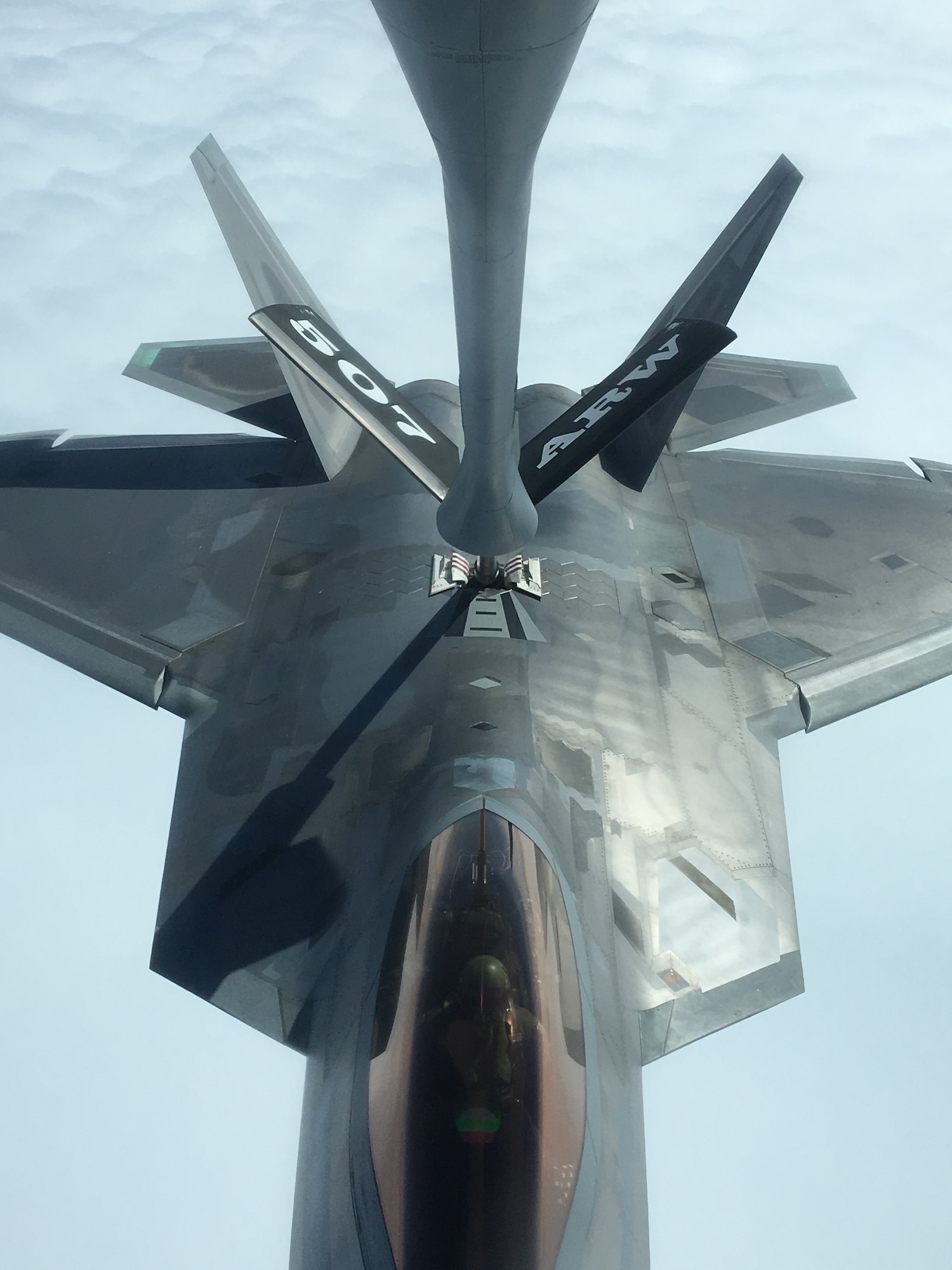 An Air Force Reserve KC-135R Stratotanker crew from the 507th Air Refueling Wing at Tinker Air Force Base, Oklahoma, refuels a U.S. Air Force F-22 Raptor Nov. 5, 2018, from Tyndall Air Force Base, Florida, while en route to Hill Air Force Base, Utah.
