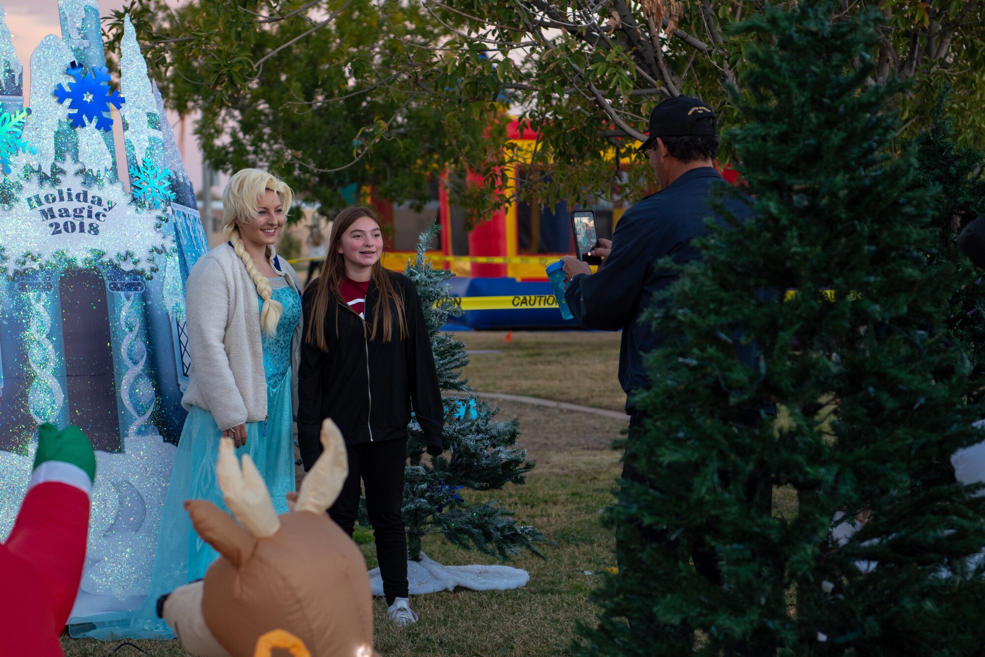 A Holiday Magic 2018 participant poses for a photo with Elsa, Dec. 7, 2018, at Luke Air Force Base, Ariz.