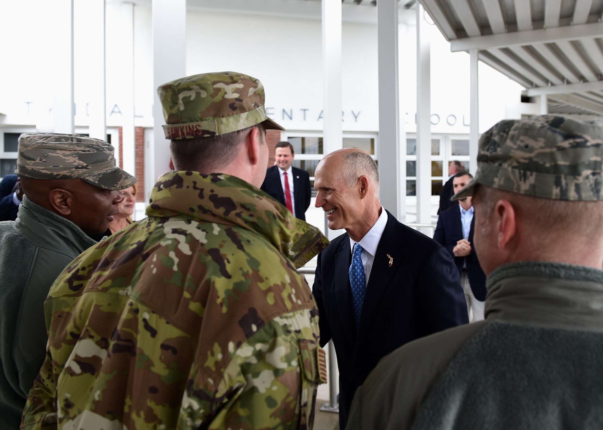 Gov. Rick Scott, current governor of Florida, greets 325th Fighter Wing leadership during a visit to the re-opening of Tyndall Elementary School near Tyndall Air Force Base, Fla., Dec. 10, 2018. Scott visited the area numerous times in the wake of Hurricane Michael. (U.S. Air Force photo by Senior Airman Isaiah J. Soliz