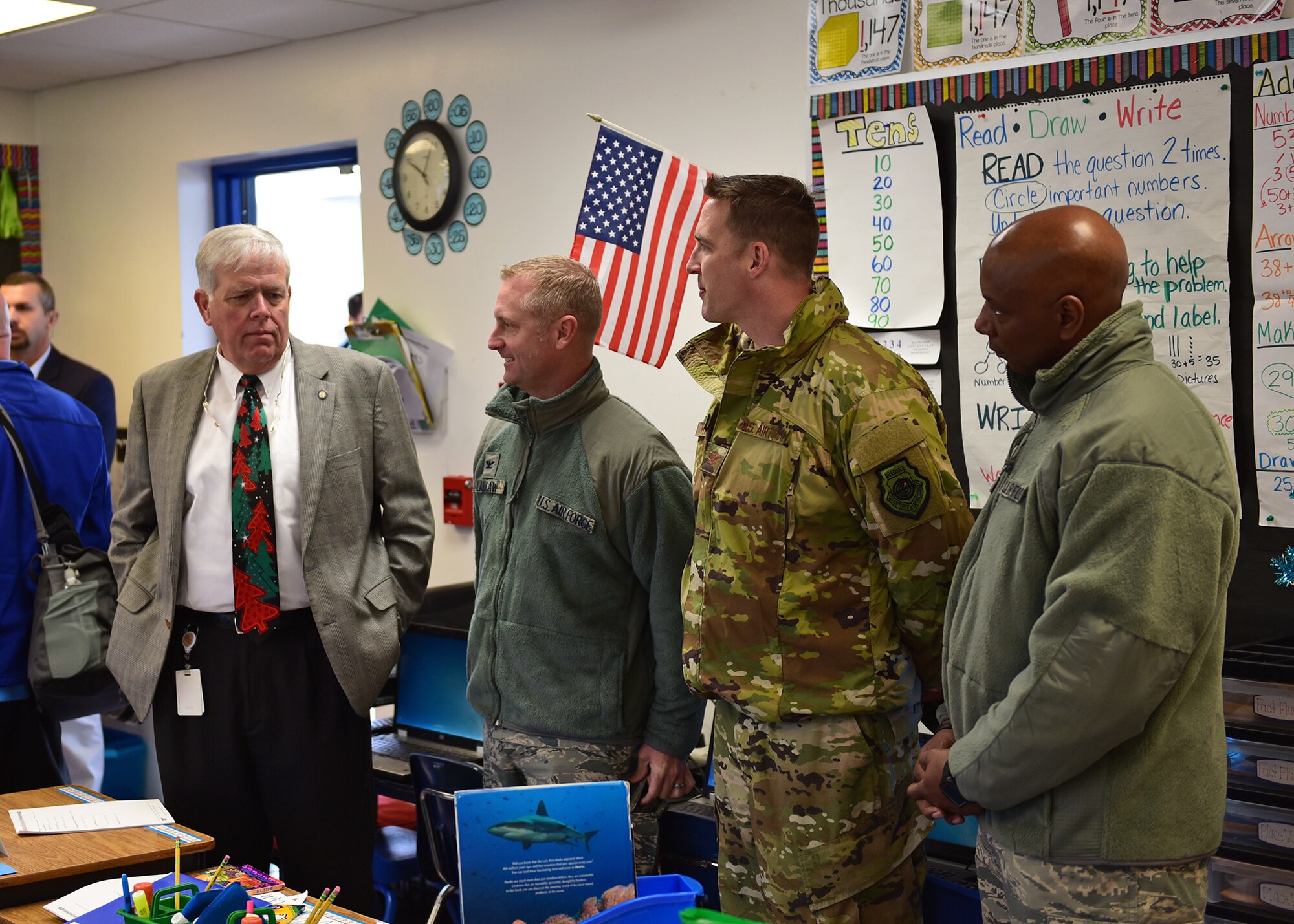 From left to right, William Husfelt, Bay District Schools superintendent, Col. Brain Laidlaw, 325th Fighter Wing commander, Col. Jefferson Hawkins, 325th FW vice commander, and Chief Master Sgt. Craig Williams, 325th FW command chief, wait for students to arrive during the re-opening of Tyndall Elementary School near Tyndall Air Force Base, Fla., Dec. 10, 2018. Open for the first time since Hurricane Michael, approximately 200 of the original 750 students returned to school, many of whom have parents working at Tyndall. (U.S. Air Force photo by Senior Airman Isaiah J. Soliz)